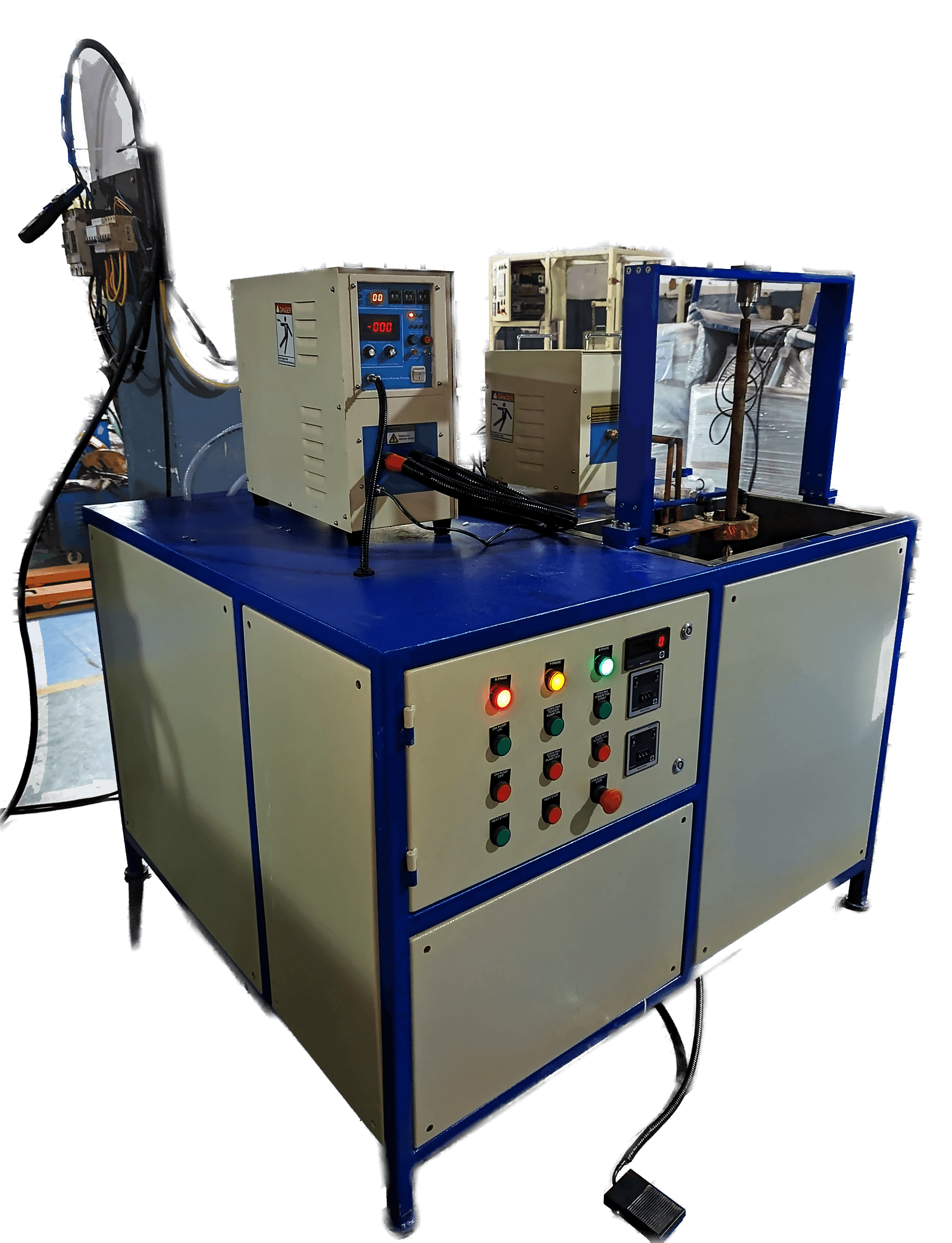 ABE-25AB induction hardening machine on our shop floor: a blue-framed cabinet with a digital controller, indicator lamps and the coil workstation above.