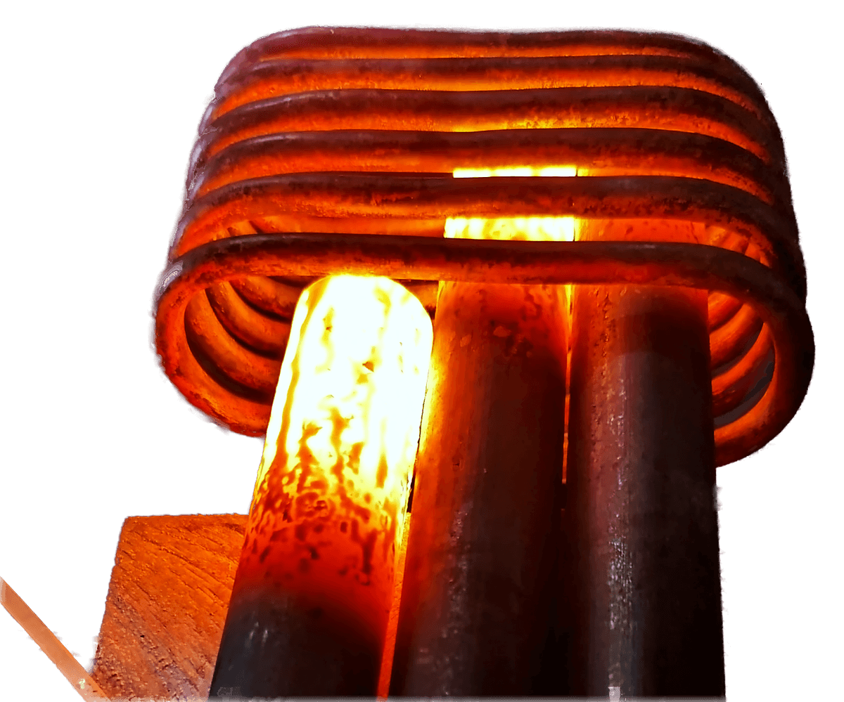 A steel bar glowing bright orange inside a multi-turn copper induction coil, with the coil itself remaining unheated.