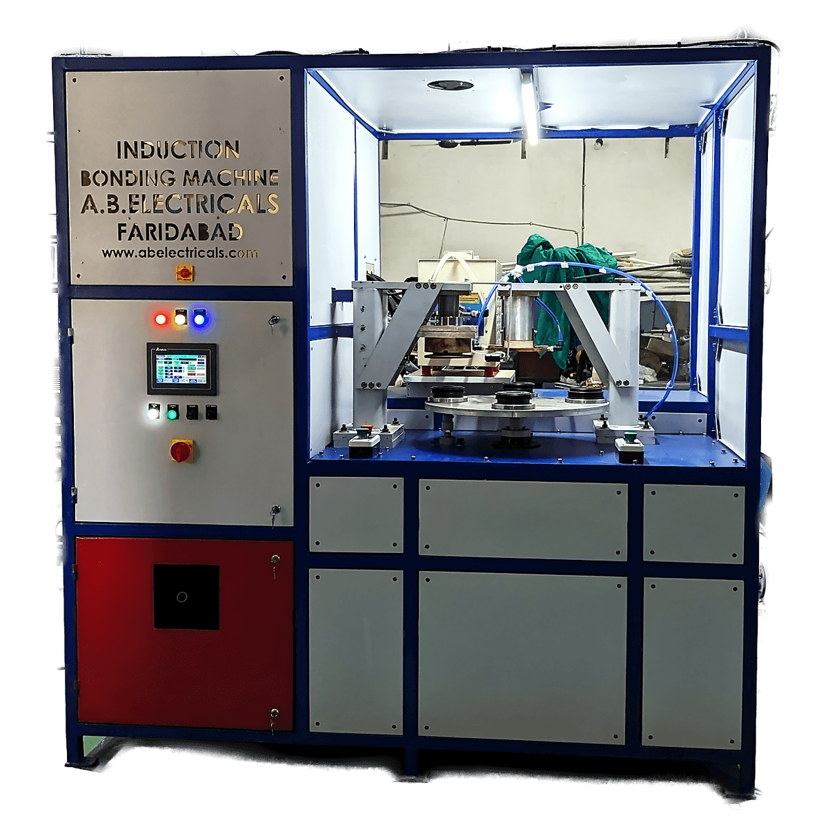 PLC based rotary induction bonding machine at our works: a guarded cell with a rotary indexing table, touchscreen control panel and blue framed enclosure.
